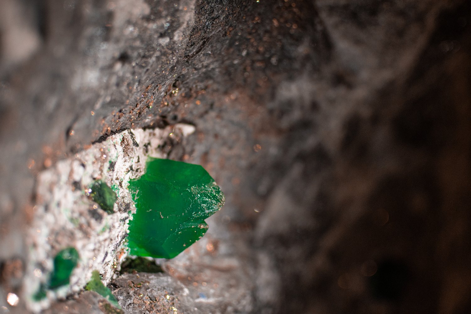 Rough tsavorite crystal in host rock at a controlled mine